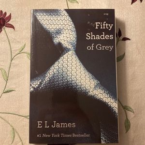 Like NEW - the classic 2011 book “Fifty Shades of Grey” by E L James